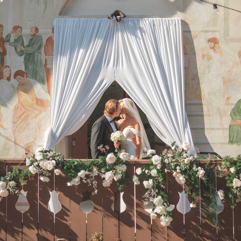 Couple at wedding chapel front doors